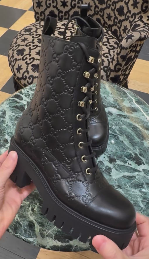 Black engraved Italian leather ankle boots