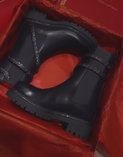 Black diamond sequined stripes wrap around black leather boots