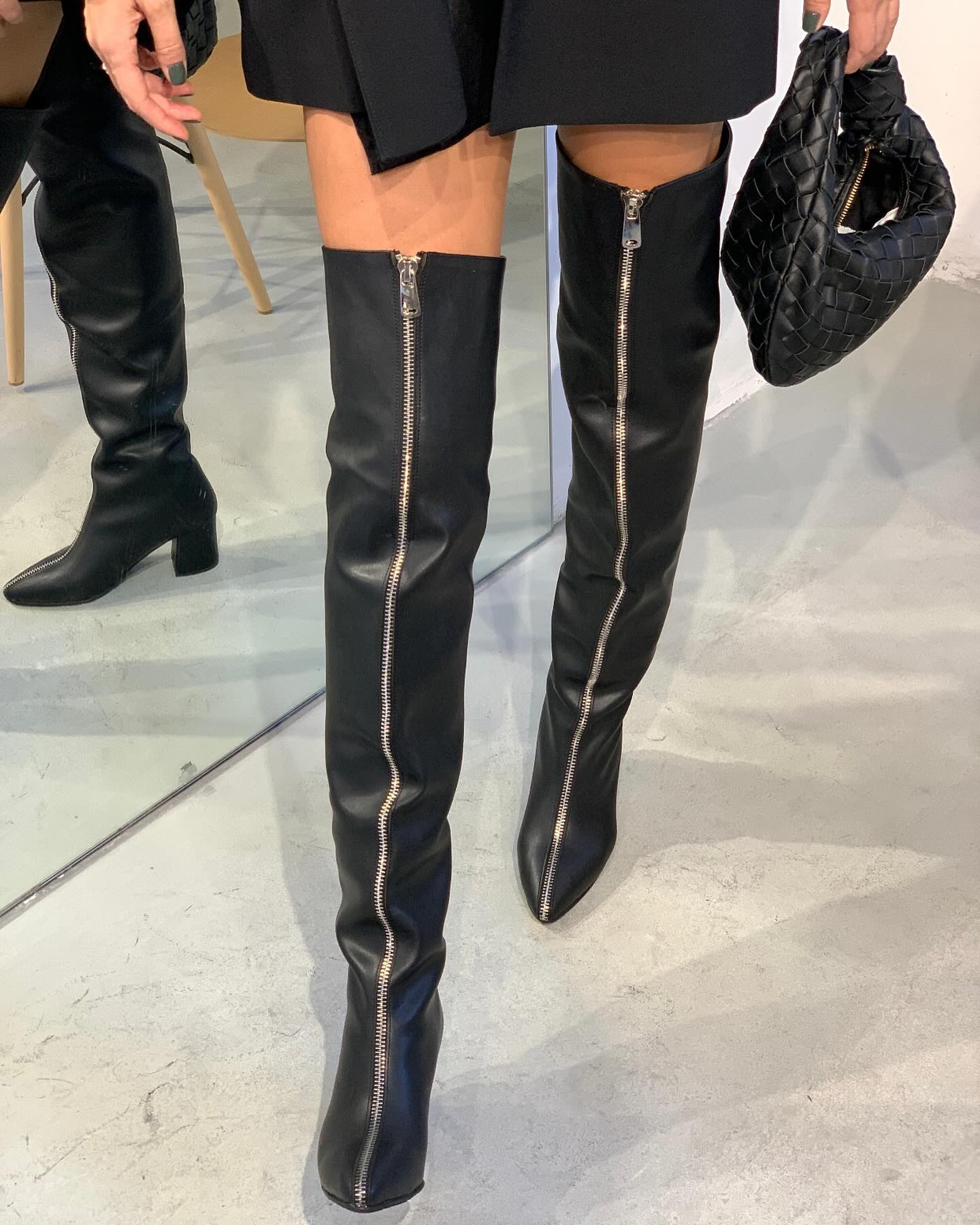 Black and silver zipper high boots