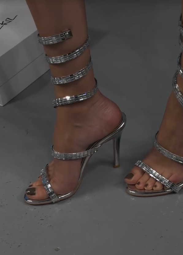 Elegant sequined strips wrapped around high heels