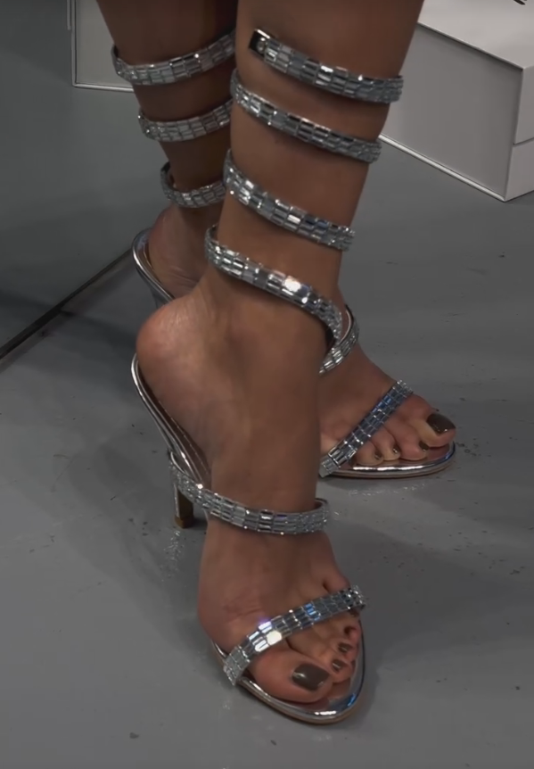 Elegant sequined strips wrapped around high heels