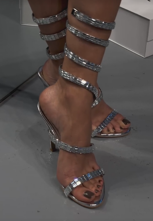 Elegant sequined strips wrapped around high heels