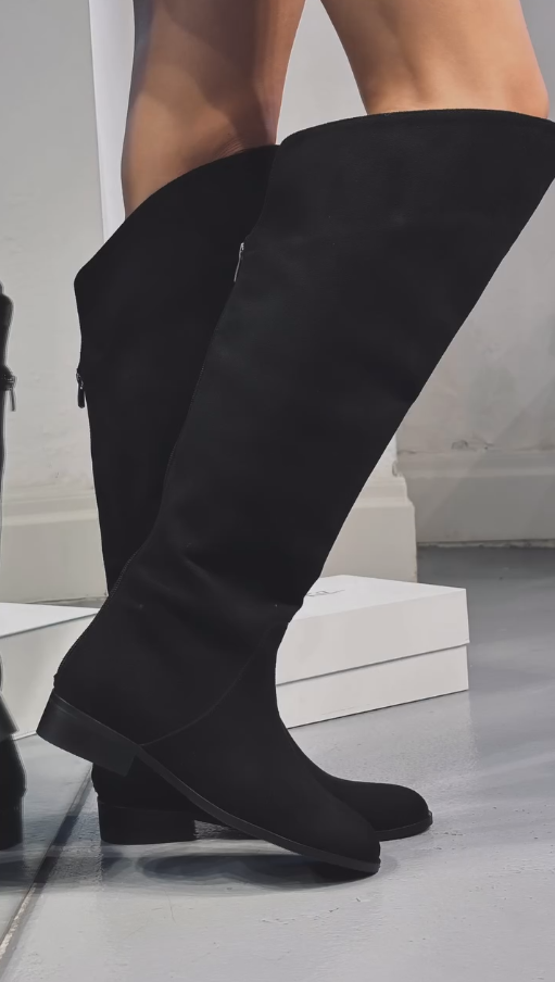 Black zippered soft-soled flat high boots