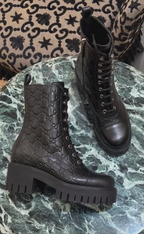 Black engraved Italian leather ankle boots