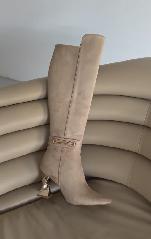 Gold rotating heel high boots