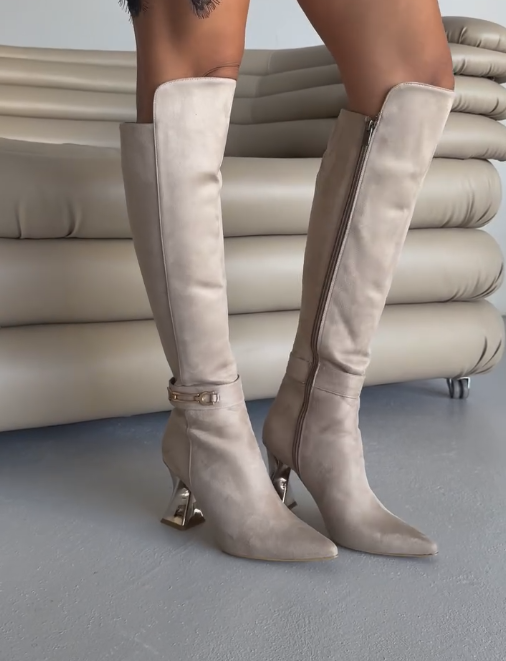 Gold rotating heel high boots