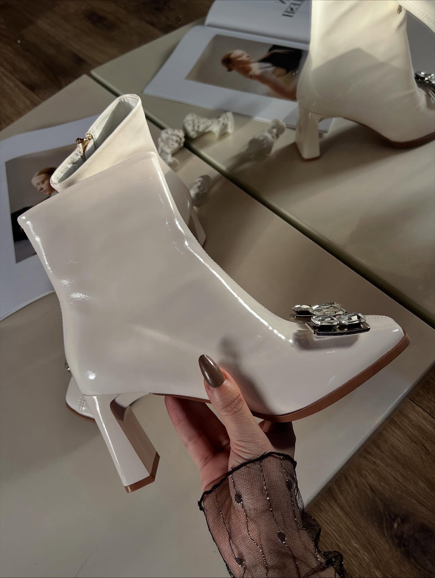 Gem-embellished cream boots